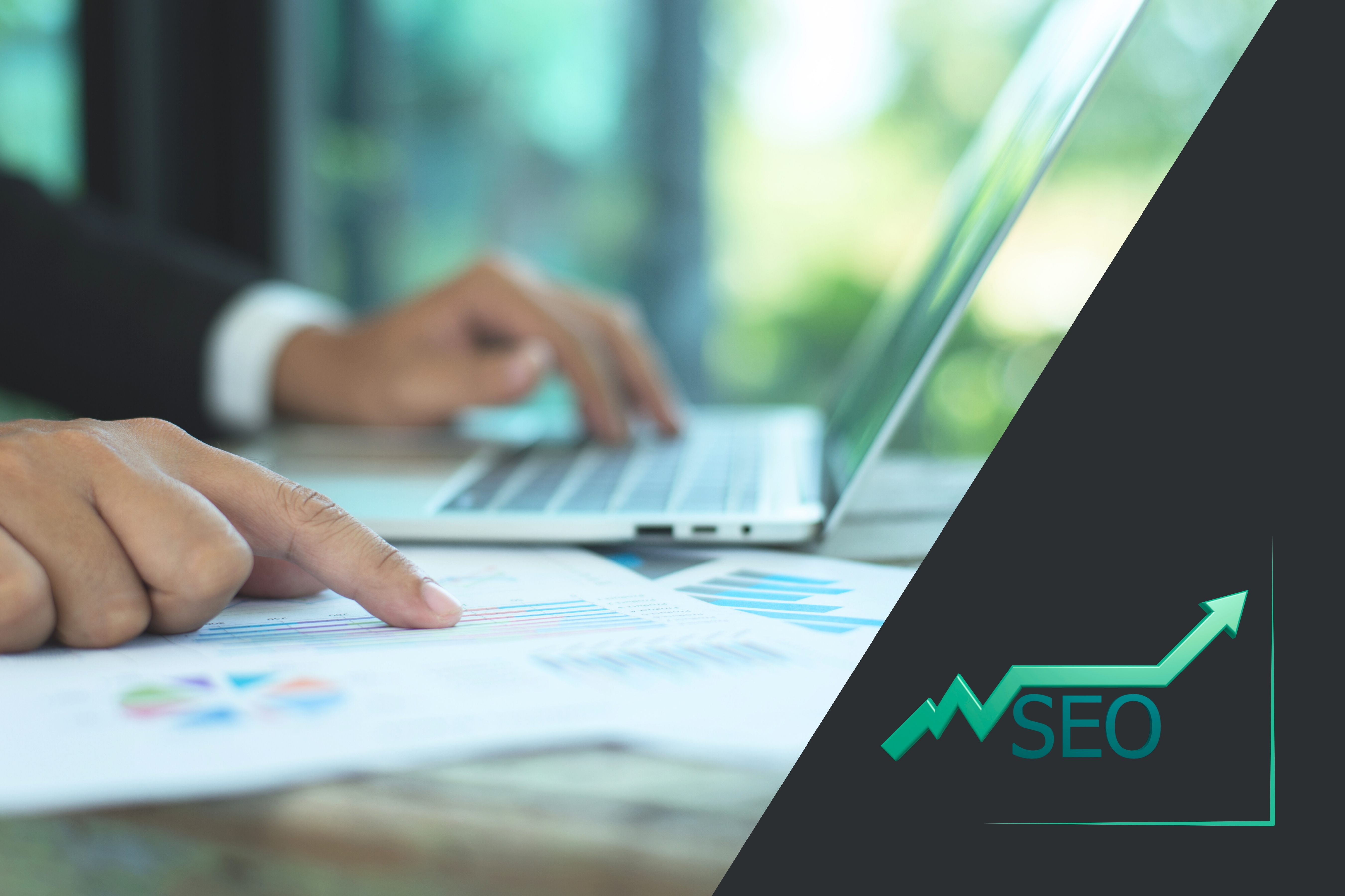 Laptop and tablet with SEO graphic and upward arrow representing digital marketing growth