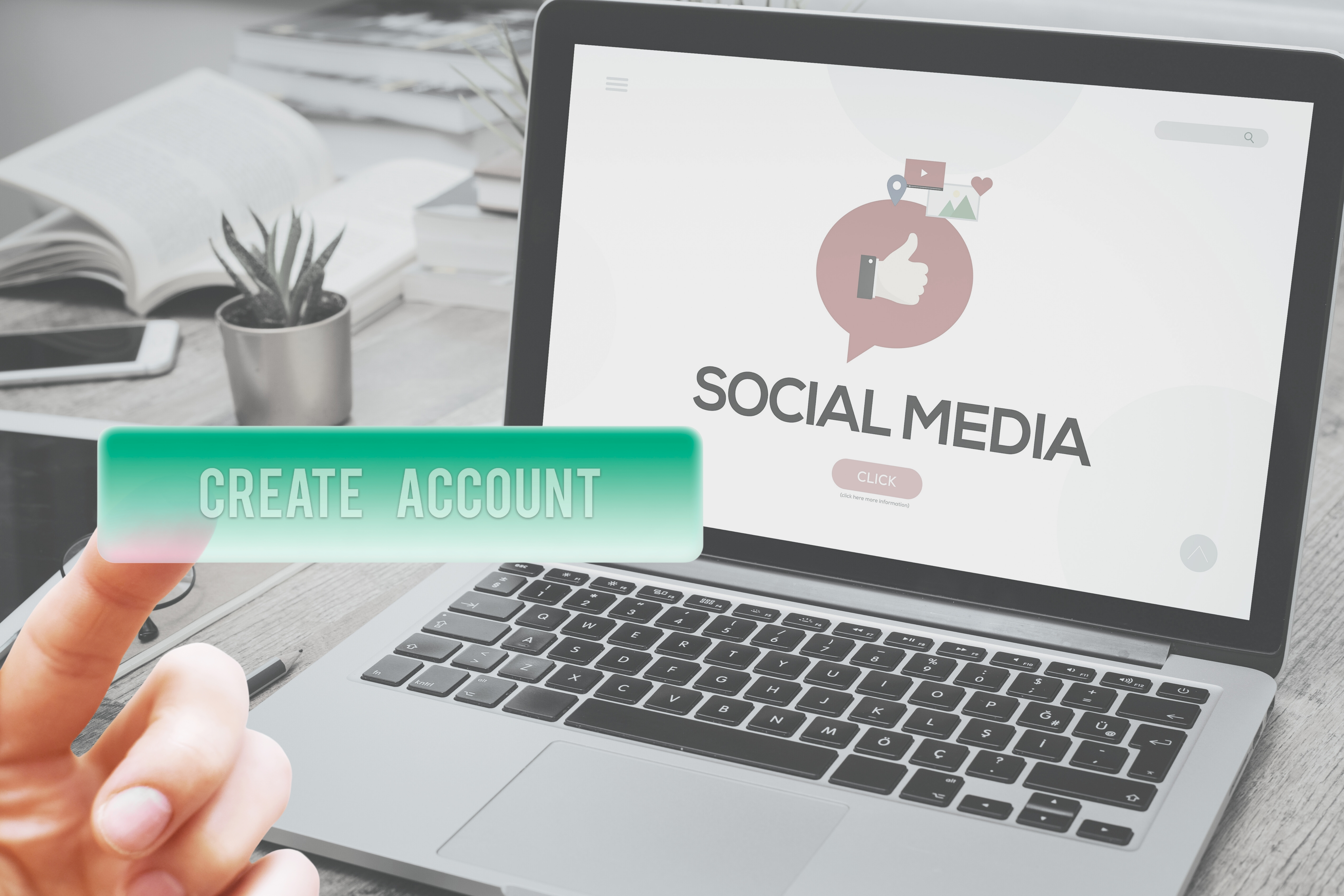 Laptop screen with social media icons and create account button